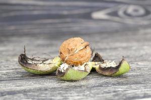 Walnuts on a wooden table photo