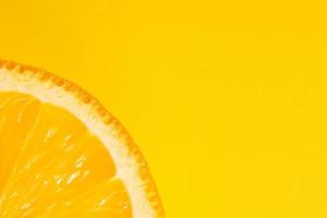 Fresh juicy fruit, orange, yellow background, copy space photo