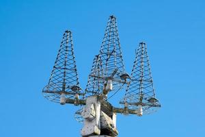 Mast of ship with navigation equipment, bottom view photo