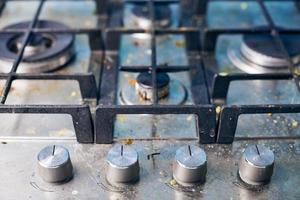 Dirty stove top with oil splatters, fat stains and food leftovers photo