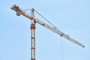 Construction crane working on building complex photo