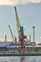 Harbor cranes, container ship terminal, cargo container yard photo