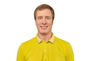 Portrait of funny young male in yellow T-shirt isolated on white background, handsome happy man photo