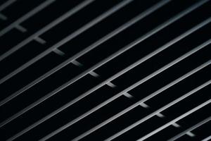 Office grille ceiling. Modern black metal grille ceiling, suspended covering. Abstract design texture. photo