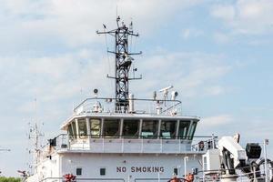 Ship bridge for navigation and control. Cargo ship waiting for a captain and crew. Vessel is ready to shove off and start new voyage. photo