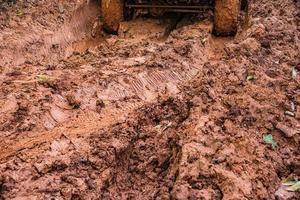 Tire tracks on a muddy road. photo