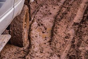 Tire tracks on a muddy road. photo