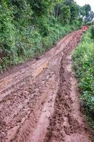 Tire tracks on a muddy road. photo