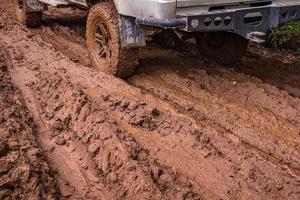 Tire tracks on a muddy road. photo