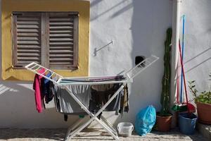 Clothes on a drying rack photo