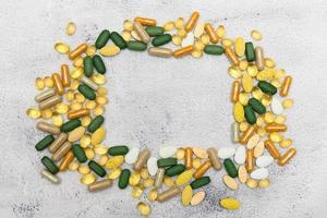 Medicine pills on a rustic table photo