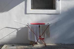 Clothes on drying rack photo