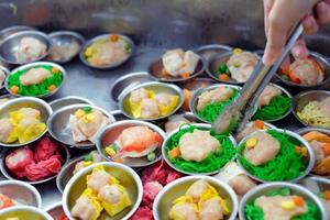 Chinese food dim sum on self service busket tray background. Tradition Dimsum is local food in Songkhla, South of Thailand. photo