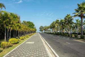 Miami Beach close to chalatat beach at Songkhla park, Thailand. Beautiful landmark of  Songkhla with coconut plam tree and road path. photo