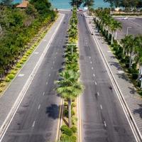 Miami Beach close to chalatat beach at Songkhla park, Thailand. Beautiful landmark of  Songkhla with coconut plam tree and road path. photo