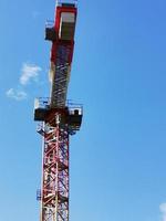 A crane next to a tower photo