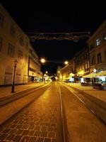 A train on the tracks at night photo