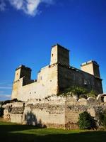 A castle on top of a stone building photo