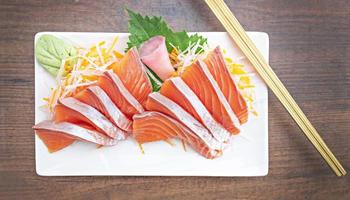 Top view Salmon Sashimi on table.  Japan food concept photo