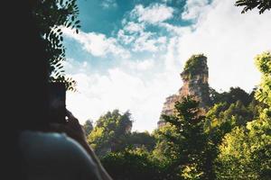 Female person take photo of Sairme pillars in summer with sky background. Hidden gem in Georgia