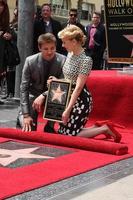 LOS ANGELES, MAY 2 - Jeremy Renner, Scarlett Johansson at the Scarlett Johansson Star Walk of Fame Ceremony at Hollywood Boulevard on May 2, 2012 in Los Angeles, CA photo