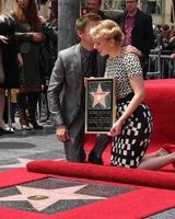 LOS ANGELES, MAY 2 - Jeremy Renner, Scarlett Johansson at the Scarlett Johansson Star Walk of Fame Ceremony at Hollywood Boulevard on May 2, 2012 in Los Angeles, CA photo