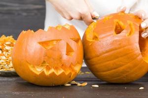 preparing a scary orange pumpkin lamp photo