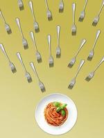 Many forks are aimed at pasta on a light yellow background. Food concept. Empty place for text, quote, sayings or logo. Close Up. Forks laid on orange background. photo