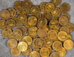 A scattering of coins. A pattern from money. Coin background photo