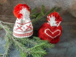 Christmas hats on fir branches. Christmas decoration. New Year's atmosphere. photo