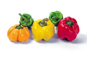 yellow and red peppers white background photo