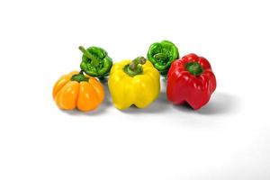 yellow and red peppers white background photo