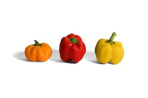 yellow and red peppers white background photo