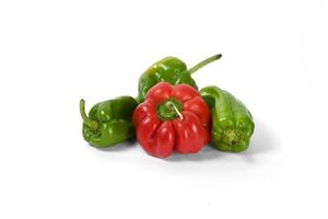 Green and red peppers white background photo