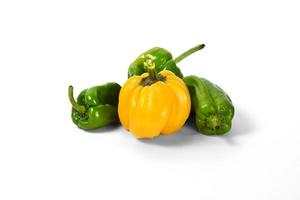 yellow and green peppers white background photo