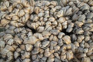 thick brown bundle of raw jute fiber Texture Background photo