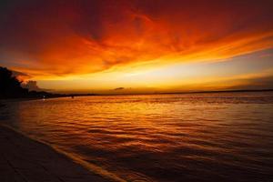 Beautiful  Scenic View Of Sea Against Orange Sky photo