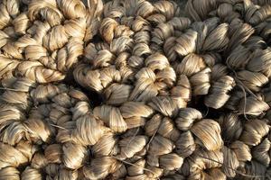 thick brown bundle of raw jute fiber Texture Background photo