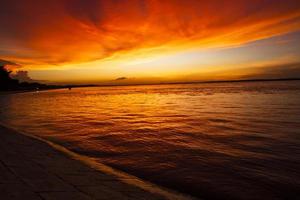 Beautiful  Scenic View Of Sea Against Orange Sky photo