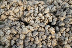 thick brown bundle of raw jute fiber Texture Background photo