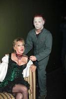 LOS ANGELES, OCT 30 - Donna Keegan and Michael Myers Costumed Guest at the sCare Foundation Halloween Launch Benefit at Conga Room, LA Live on October 30, 2011 in Los Angeles, CA photo