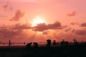 beach life atmosphere at sunset photo