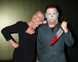 LOS ANGELES, OCT 30 - Jamie Lee Curtis and Michael Myers Costumed Guest at the sCare Foundation Halloween Launch Benefit at Conga Room  LA Live on October 30, 2011 in Los Angeles, CA photo