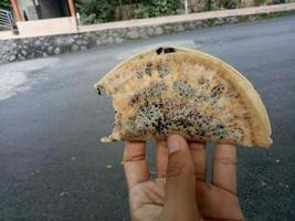 a traditional Indonesian food semi-circle cake called lekker photo