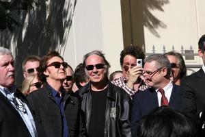 LOS ANGELES, FEB 9 - Paul McCartney, Neil Young at the Hollywood Walk of Fame Ceremony for Paul McCartney at Capital Records Building on February 9, 2012 in Los Angeles, CA photo