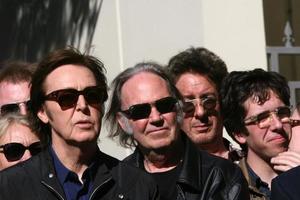 LOS ANGELES, FEB 9 - Paul McCartney, Neil Young at the Hollywood Walk of Fame Ceremony for Paul McCartney at Capital Records Building on February 9, 2012 in Los Angeles, CA photo