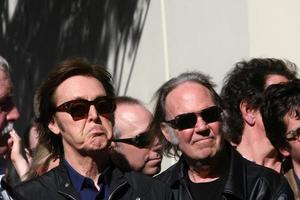 LOS ANGELES, FEB 9 - Paul McCartney, Neil Young at the Hollywood Walk of Fame Ceremony for Paul McCartney at Capital Records Building on February 9, 2012 in Los Angeles, CA photo