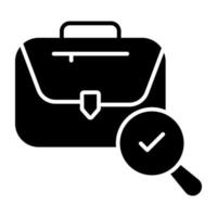 Briefcase with magnifying glass, solid icon of search job vector