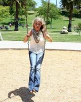 LOS ANGELES, AUG 1 - Savannah Outen playing in the park, wearing Wallflower jeans at Midtown LA on August 1, 2011 in Los Angeles, CA photo