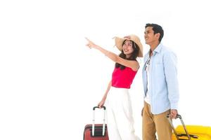 Young adult asian travel couple with luggage on isolated white background photo